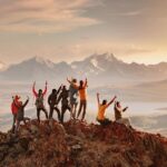 Big group of happy tourists are having fun